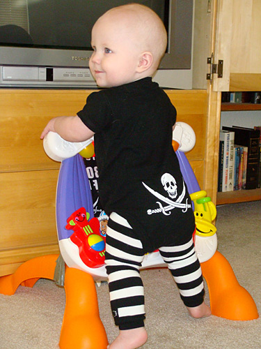 James standing in front of the TV, dressed piratical