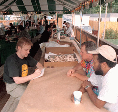 Interviewing keyboardist Mike Utley (center) and steel drums player Robert Greenidge (right), two members of Jimmy Buffett's Coral Reefer Band at Merriweather Post Pavilion in Columbia, Md.