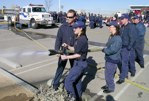 Students at Summit Leadership Academy try out the fire hose