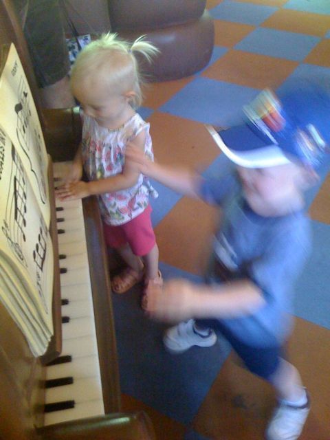 James and Isabel rock out on Goofy's piano