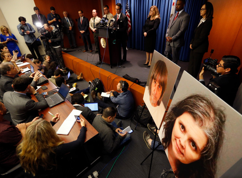 Riverside County District Attorney Mike Hestrin, at podium, takes questions from the media at a news conference regarding the couple accused of starving and torturing their 13 children in Riverside, Calif., Thursday, Jan. 18, 2018. Authorities say David and Louise Turpin could face charges including torture and child endangerment. (AP Photo/Damian Dovarganes)